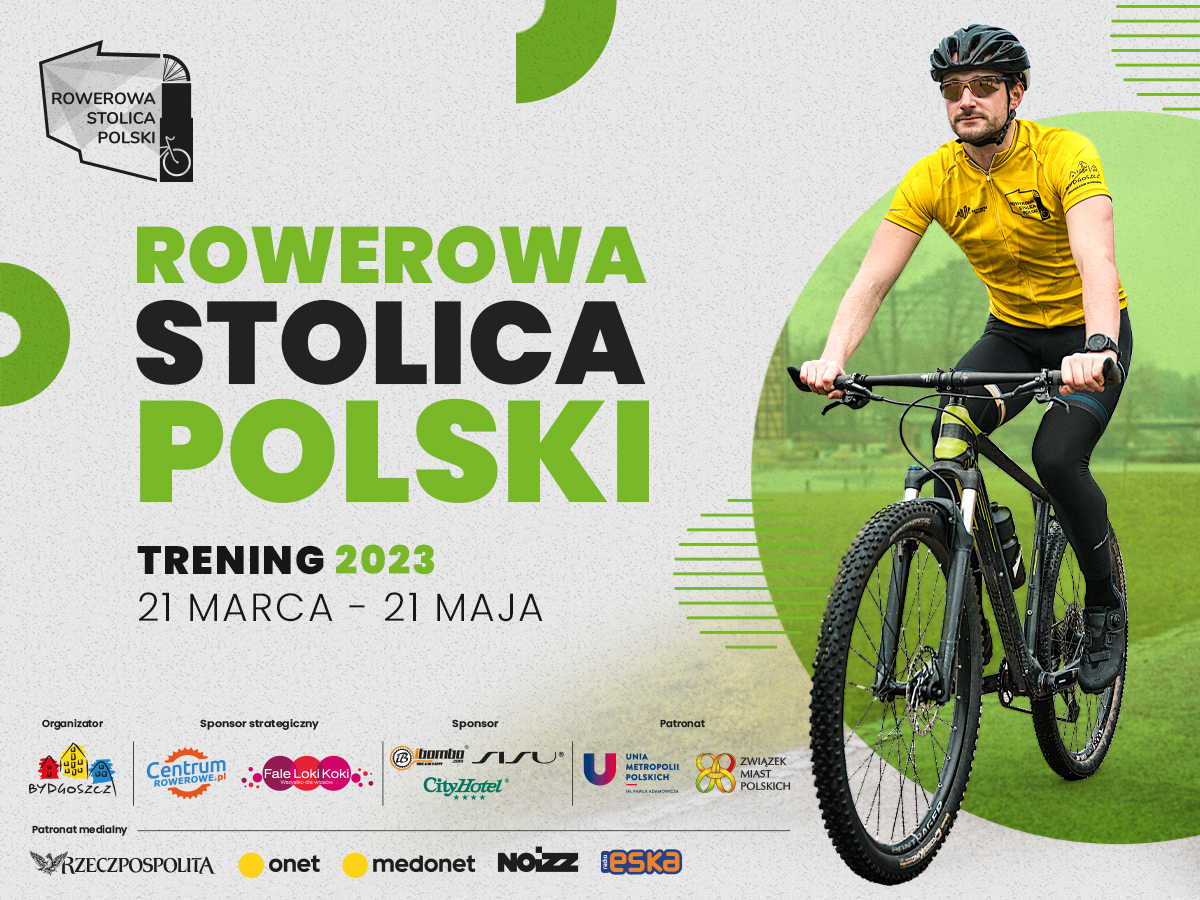 Baner reklamowy z czrno-zelonym napisem Rowerowa stolica Polski. Z prawej strony zdjęcie mężczyzny jadącego na czarnym rowerze w żółtej koszulce, okularach i z kaskiem na głowie. W dolnej części baneru umieszczone logo organizatora, sponsorów i sponsorów medialnych.