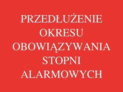 Baner w kolorze czerwonym z napisem Przedłużenie okresu obowiązywania stopni alarmowych