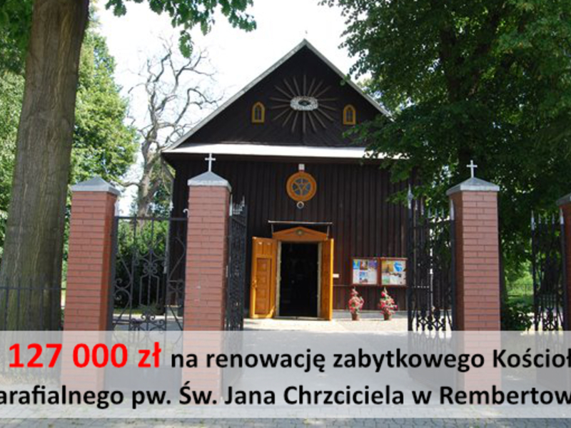 Zdjęcie przedstawia zabytkowy, drewniany kościół w Rembertowie