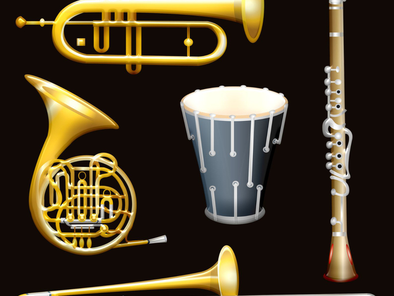 Zdjęcie przedstawia instrumenty dęte na czarnym tle