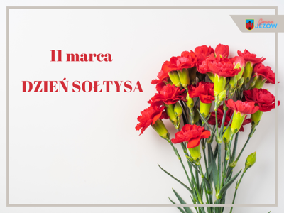 Napis: &quot;11 marca Dzień Sołtysa&quot; obok kwiaty