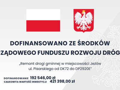 Dofinansowano ze środków Rządowego Funduszu Rozwoju Dróg "Remont drogi gminnej w miejscowości Jeżów ul. Pisarskiego od DK72 do DP2920E", Dofinansowanie: 192.546.00 zł, Całkowita wartość inwestycji: 421.398,00 zł