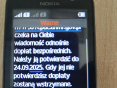 zdjęcie telefonu z treścia SMS