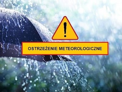 Obrazek - ostrzeżenie meteorologiczne, żółty znak ostrzegawczy, na tle parasola, pada mocny deszcz