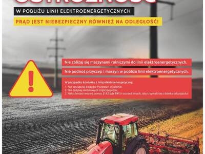 Zdjęcie plakatu dotyczącego zachowania ostrożności w pobliżu linii elektroenergetycznych
