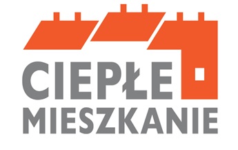 Na zdjęciu widać kontury budynków oraz napis ciepłe mieszkanie