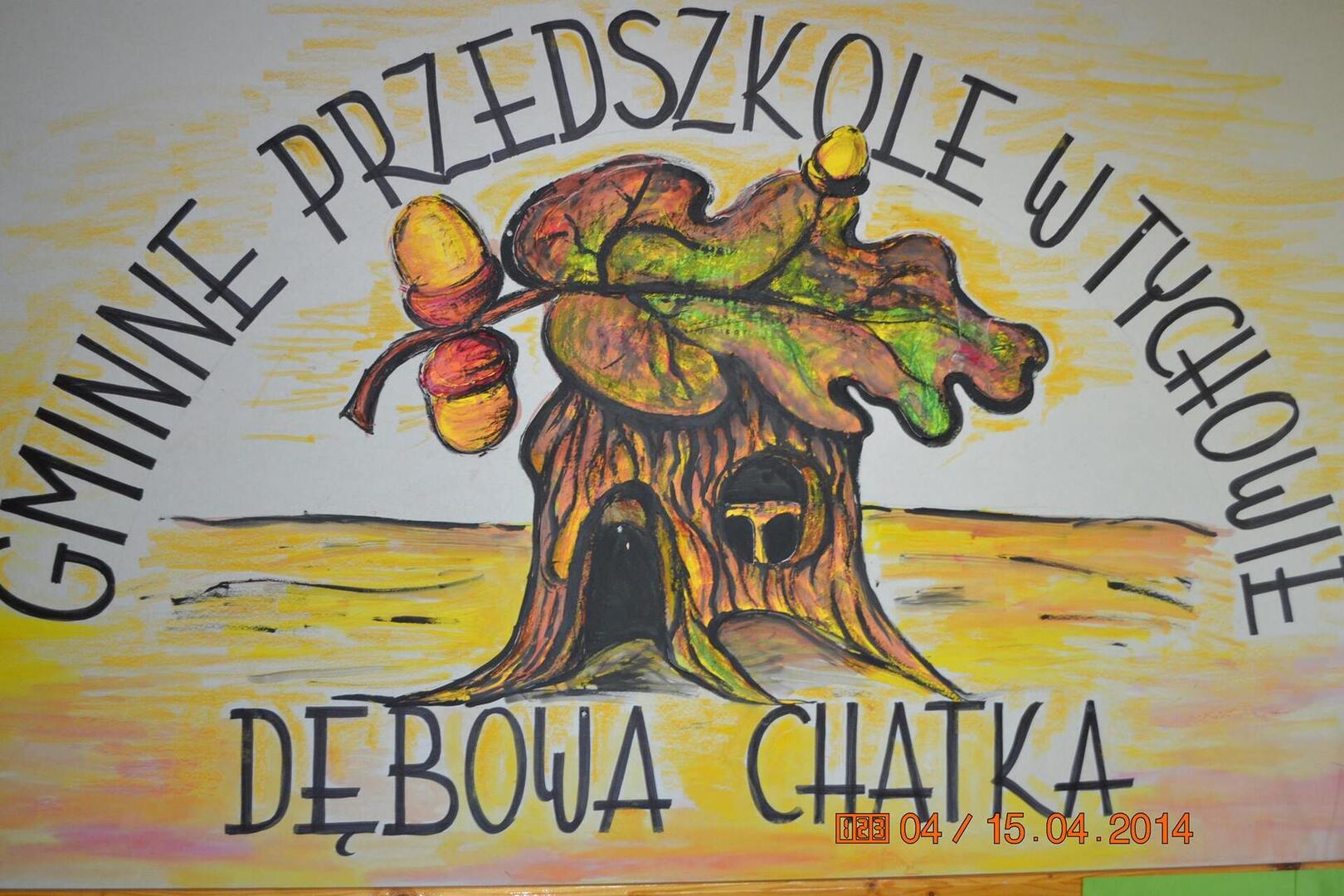 na zdjęciu logo Gminnego Przedszkola w Tychowie "Dębowa Chatka"